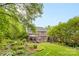 Landscaped backyard featuring lush greenery and an inviting outdoor space at 9918 Windrow Dr, Indian Trail, NC 28079