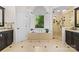 This bathroom features an enclosed tub, standing shower, and large, bright window at 9918 Windrow Dr, Indian Trail, NC 28079