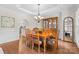 Traditional dining room with wood table, hutch, and hardwood floors at 9918 Windrow Dr, Indian Trail, NC 28079