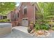 Brick home with a beautiful stone landscaped backyard, garage and hot tub at 9918 Windrow Dr, Indian Trail, NC 28079
