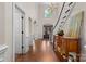 Grand foyer with hardwood floors, high ceilings, decorative chandelier, and staircase at 9918 Windrow Dr, Indian Trail, NC 28079