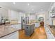 Spacious kitchen with granite counters, stainless steel fridge, and a center island, great for entertaining at 9918 Windrow Dr, Indian Trail, NC 28079