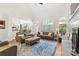 Open living space with vaulted ceilings, arched windows, and a seamless transition to the kitchen and dining area at 9918 Windrow Dr, Indian Trail, NC 28079