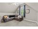 Cozy living room with a comfortable couch and a bright window at 9918 Windrow Dr, Indian Trail, NC 28079