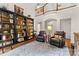 Elegant living room featuring custom bookshelves, hardwood floors, and a comfortable seating area at 9918 Windrow Dr, Indian Trail, NC 28079