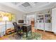 Well-lit office featuring hardwood floors, coffered ceilings, and French doors at 9918 Windrow Dr, Indian Trail, NC 28079