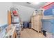 This storage room is ready to organize, with an armoire and storage bins at 9918 Windrow Dr, Indian Trail, NC 28079