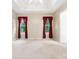 Bedroom features a trey ceiling, ceiling fan, cream walls and two windows with red curtains at 1028 Swaying Oats Dr, York, SC 29745