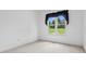 A bedroom with bright natural light and a view of the landscaped backyard at 1028 Swaying Oats Dr, York, SC 29745