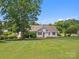 Well-maintained home with a large green lawn and lush landscaping at 1028 Swaying Oats Dr, York, SC 29745