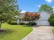 Charming single-story home with a well-manicured lawn and a curved driveway at 1028 Swaying Oats Dr, York, SC 29745
