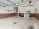 Spacious garage offers ample parking and storage space with brick and concrete flooring at 1028 Swaying Oats Dr, York, SC 29745