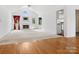 Sun-drenched living room has vaulted ceilings, white fireplace, large windows, and is freshly painted at 1028 Swaying Oats Dr, York, SC 29745