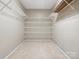 Spacious walk-in closet provides ample storage with wall-to-wall shelving at 1028 Swaying Oats Dr, York, SC 29745