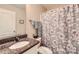 Neutral bathroom featuring granite counters, a floral shower curtain, and modern fixtures at 105 W 17Th St, Salisbury, NC 28144