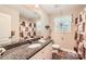 Bathroom featuring granite countertops, a decorative shower curtain, and great vanity storage at 105 W 17Th St, Salisbury, NC 28144