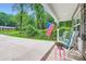 Relaxing front porch featuring comfortable rocking chairs, flowers, and an American flag at 105 W 17Th St, Salisbury, NC 28144