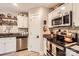 Modern kitchen with stainless steel appliances, granite countertops, and white cabinetry at 105 W 17Th St, Salisbury, NC 28144