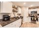 Charming kitchen featuring granite countertops, stainless steel appliances, and decorative display shelving at 105 W 17Th St, Salisbury, NC 28144