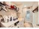 Bright laundry area with modern appliances, storage shelves, and outdoor access at 105 W 17Th St, Salisbury, NC 28144