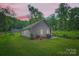 Backyard view of a home with a patio, grill, and lush green lawn at 105 W 17Th St, Salisbury, NC 28144