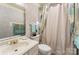 Cozy bathroom featuring a single sink vanity and shower with a decorative curtain at 1076 Braxton Dr, Concord, NC 28025