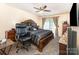 Primary bedroom suite with a luxurious bed, and sliding glass doors to outdoor living space at 1076 Braxton Dr, Concord, NC 28025