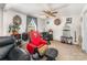 Home office and sitting area features an accent chair with sports decor, and a mini fridge at 1076 Braxton Dr, Concord, NC 28025