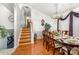 Dining area with hardwood floors and stairway to upper level at 1076 Braxton Dr, Concord, NC 28025