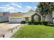 Charming single-story home with manicured lawn, brick accents, and attached two-car garage at 1076 Braxton Dr, Concord, NC 28025