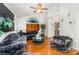 Bright living room with wood floors, large windows, and elegant furnishings at 1076 Braxton Dr, Concord, NC 28025