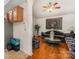 Cozy living room features hardwood floors, a ceiling fan, and traditional decor at 1076 Braxton Dr, Concord, NC 28025