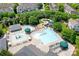 An aerial view showcases the community pool featuring a water slide and ample lounge seating at 10911 Skymont Dr, Huntersville, NC 28078