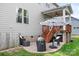 A backyard patio with seating and an umbrella creates a perfect outdoor space for relaxing or entertaining guests at 10911 Skymont Dr, Huntersville, NC 28078