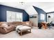 A cozy room with a comfy couch, window, and desk, perfect for relaxation and productivity at 10911 Skymont Dr, Huntersville, NC 28078