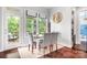 Cozy breakfast nook with a table, chairs, a rug, and a door to the deck at 10911 Skymont Dr, Huntersville, NC 28078