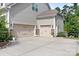 Spacious three-car garage featuring neutral paint, stone accents, and abundant parking space at 10911 Skymont Dr, Huntersville, NC 28078