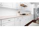 Modern kitchen features white cabinets, stainless steel appliances, and subway tile backsplash at 10911 Skymont Dr, Huntersville, NC 28078