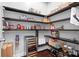 Well-organized pantry with dark wood shelving and a built-in wine cooler for convenient storage at 10911 Skymont Dr, Huntersville, NC 28078