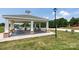 A community picnic shelter with tables, brick supports, and views of the recreational area at 10911 Skymont Dr, Huntersville, NC 28078