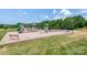 A modern community playground with swings, slides, and climbing equipment at 10911 Skymont Dr, Huntersville, NC 28078