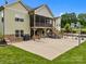 The backyard features a patio, a screened porch, stairs, and a basketball court at 1115 Wynnbrook Way, Concord, NC 28027