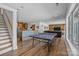 Finished basement with a ping pong table, wet bar, and entertainment area at 1115 Wynnbrook Way, Concord, NC 28027