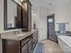 Primary bathroom featuring dual vanities, soaking tub, and a glass-enclosed shower at 1115 Wynnbrook Way, Concord, NC 28027