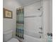 Cozy bathroom with a shower and tub with subway tile and decorative accents at 1115 Wynnbrook Way, Concord, NC 28027