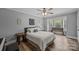Inviting bedroom with a neutral color palette, wood floors, and a cozy window nook at 1115 Wynnbrook Way, Concord, NC 28027