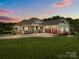 Charming single-Gathering home with a well-manicured lawn and a three-car garage at 1115 Wynnbrook Way, Concord, NC 28027