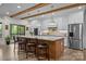 A spacious kitchen with a large island, pendant lighting, and stainless steel appliances at 1115 Wynnbrook Way, Concord, NC 28027