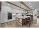 Beautiful kitchen with an island, breakfast bar, marble countertops, and stainless steel double ovens at 1115 Wynnbrook Way, Concord, NC 28027