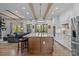 Bright kitchen featuring a large island with bar seating, modern appliances, and hardwood floors at 1115 Wynnbrook Way, Concord, NC 28027